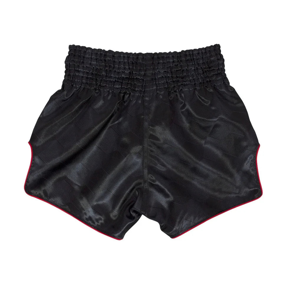 Black Muay Thai shorts with red trim on a white background
