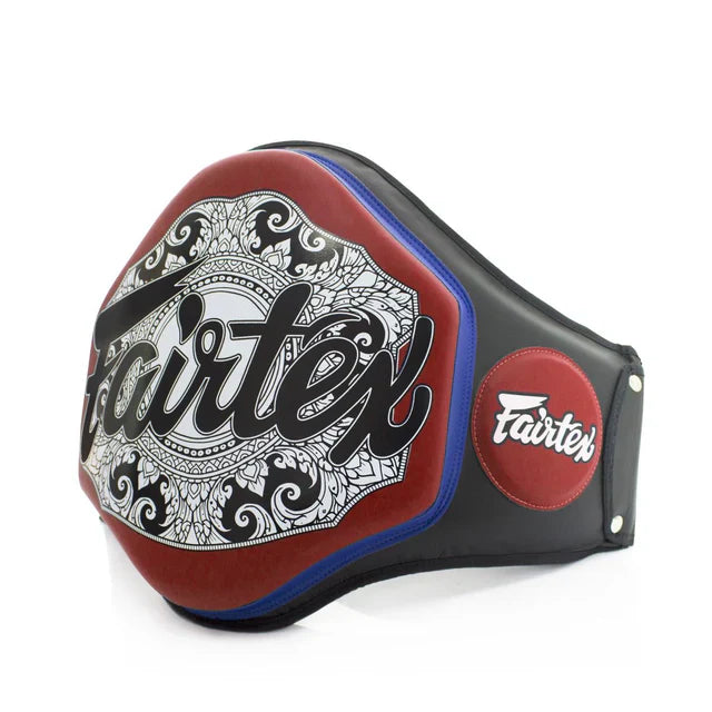 Fairtex boxing belly pad with intricate design on a white background