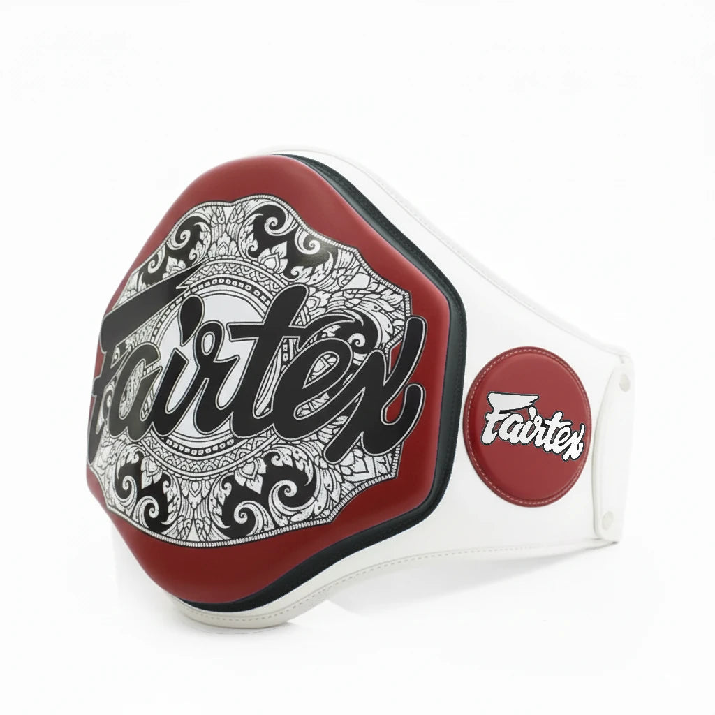 Fairtex boxing belly pad with intricate design and brand logo on a white background