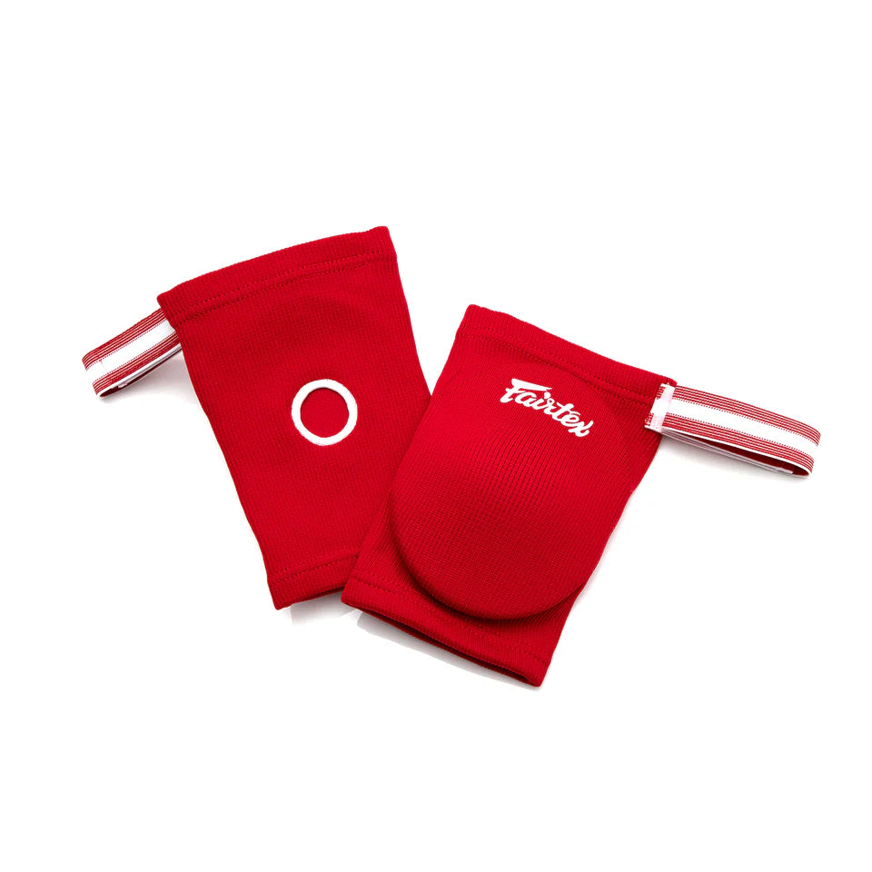 Red elbow pads with white straps and visible branding on a white background