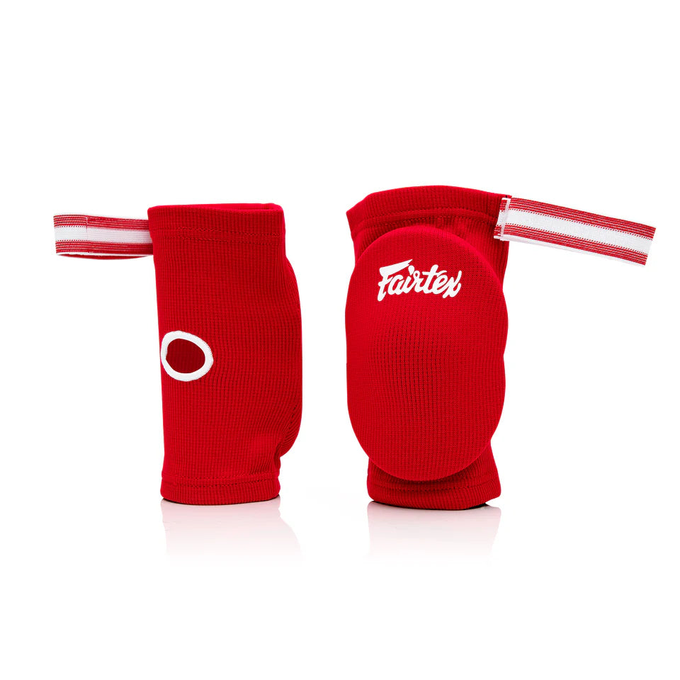 Red Fairtex elbow pads on a white background