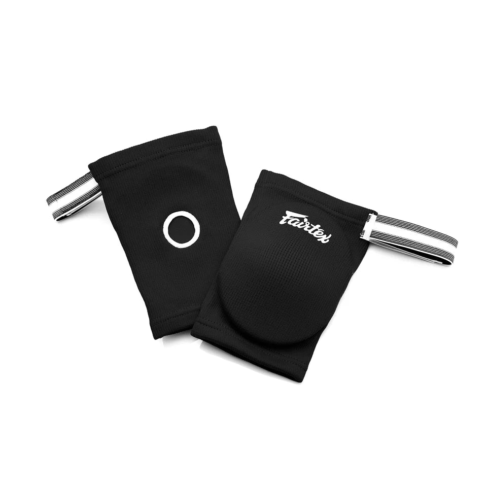 Two black elbow pads with metal straps on a white background