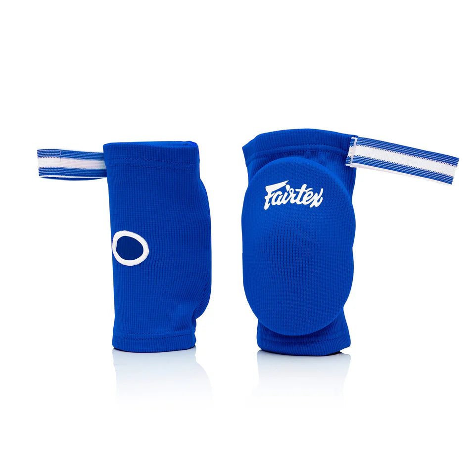 Pair of blue elbow pads with Fairtex logo on a white background