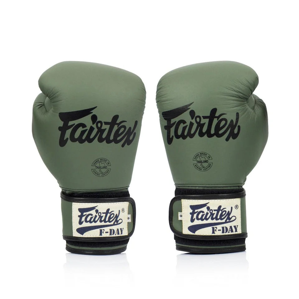 Pair of army green Fairtex boxing gloves on a white background