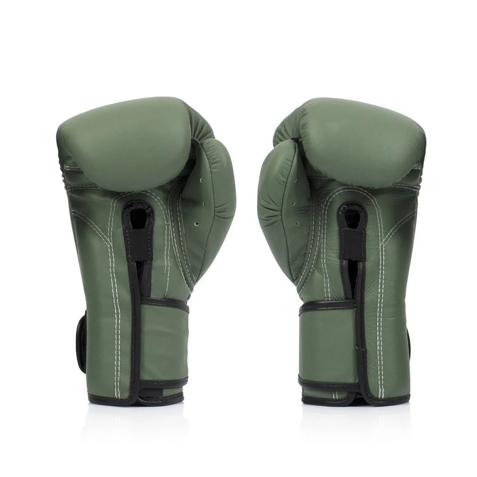 Pair of green boxing gloves on a white background