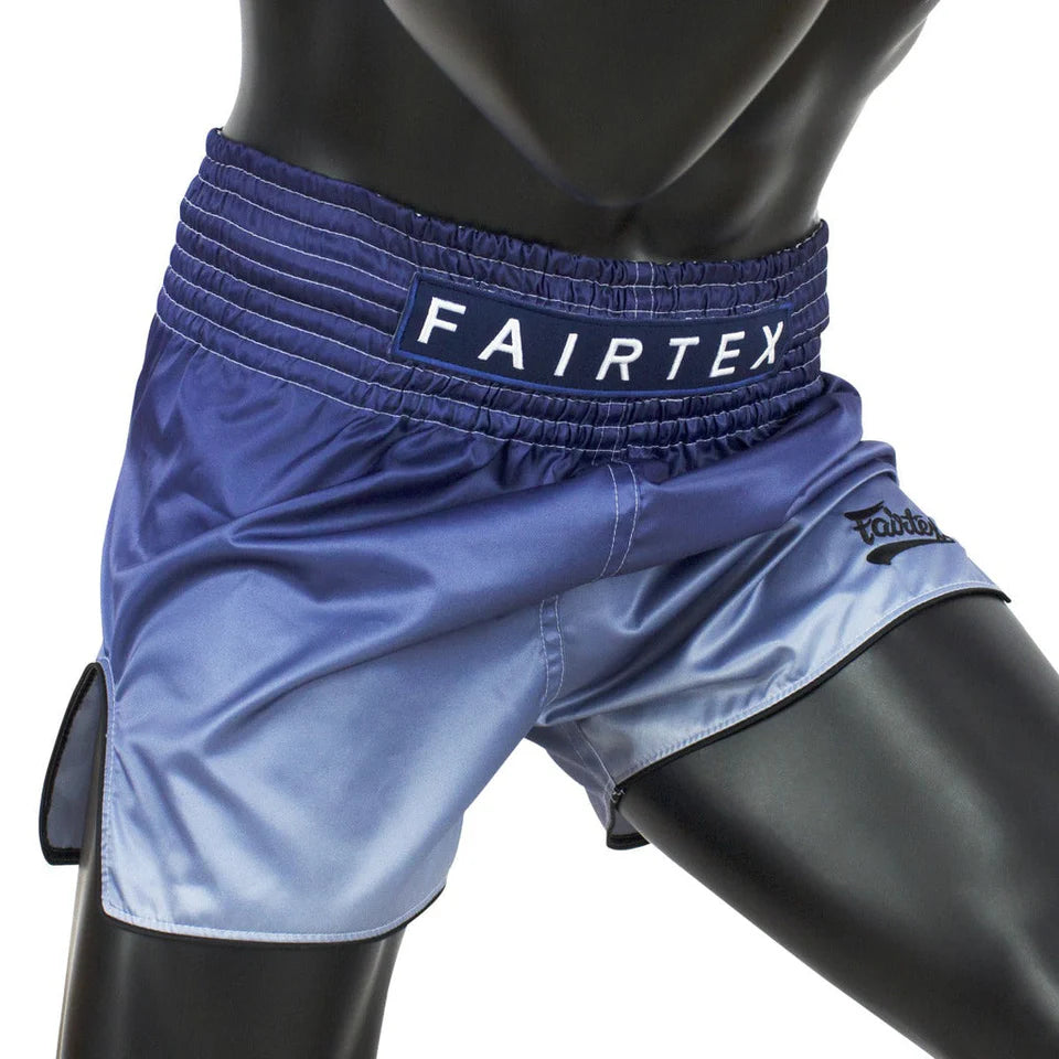 Blue Fairtex shorts on a mannequin against a white background
