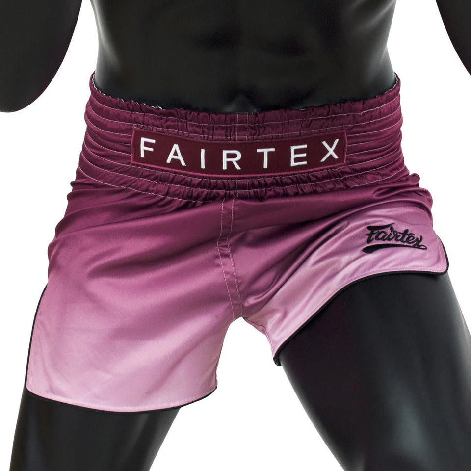 Pink Fairtex boxing shorts on a black mannequin
