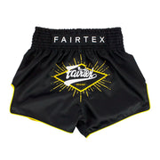 Black Fairtex shorts with yellow logo on a white background