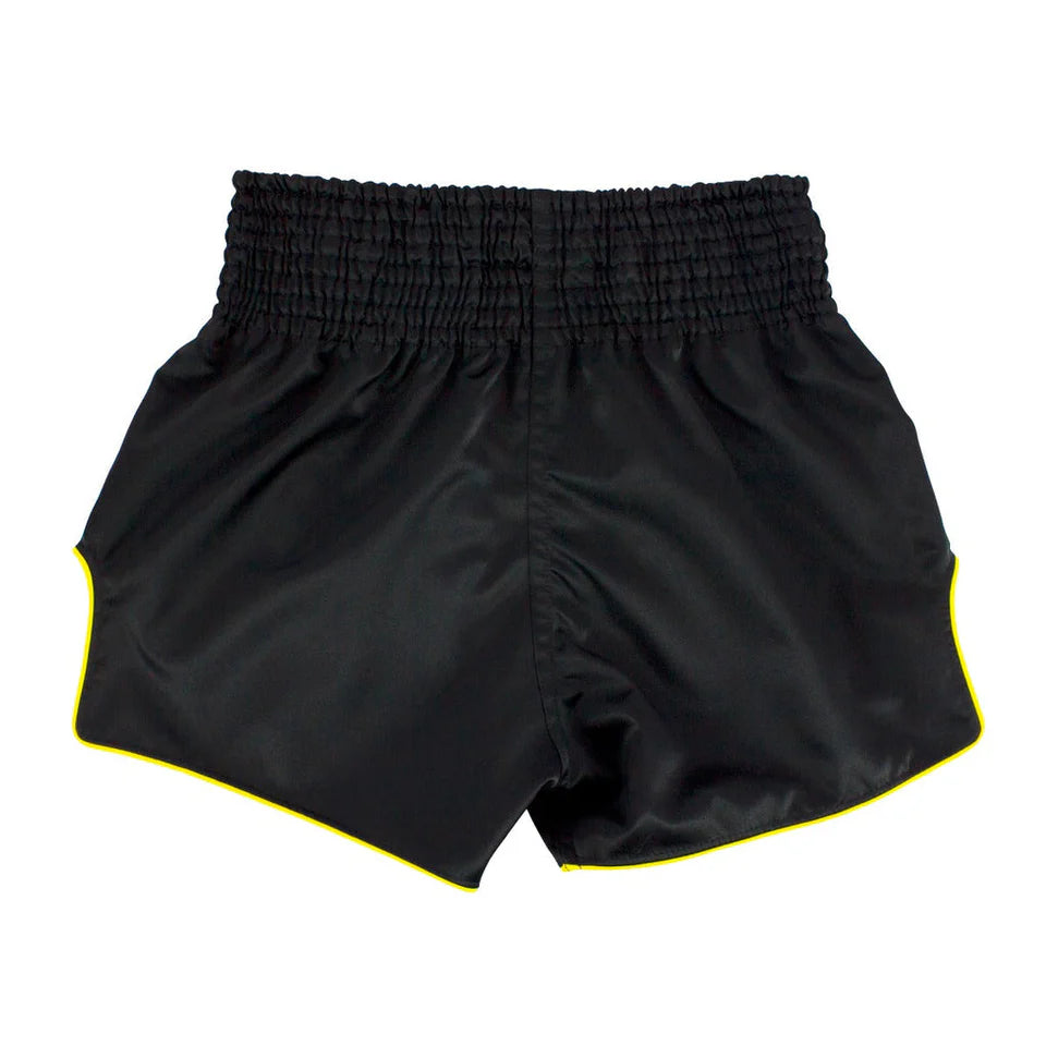 Black shorts with yellow trim on a white background