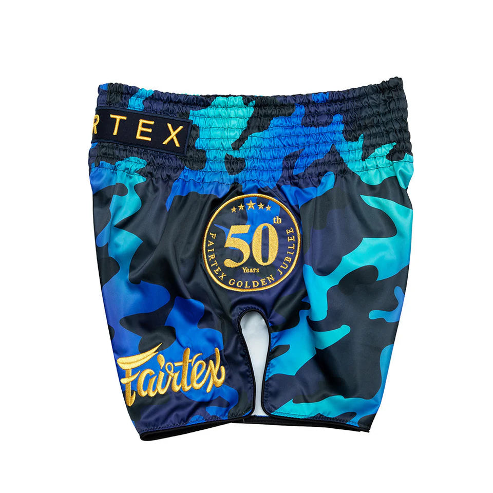 Blue camouflage Muay Thai shorts with Fairtex branding on a white background