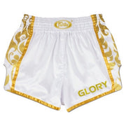 White Muay Thai shorts with gold trim and 'GLORY' text on a white background