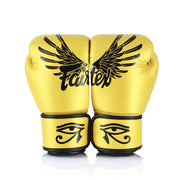 Yellow boxing gloves with black designs on a white background