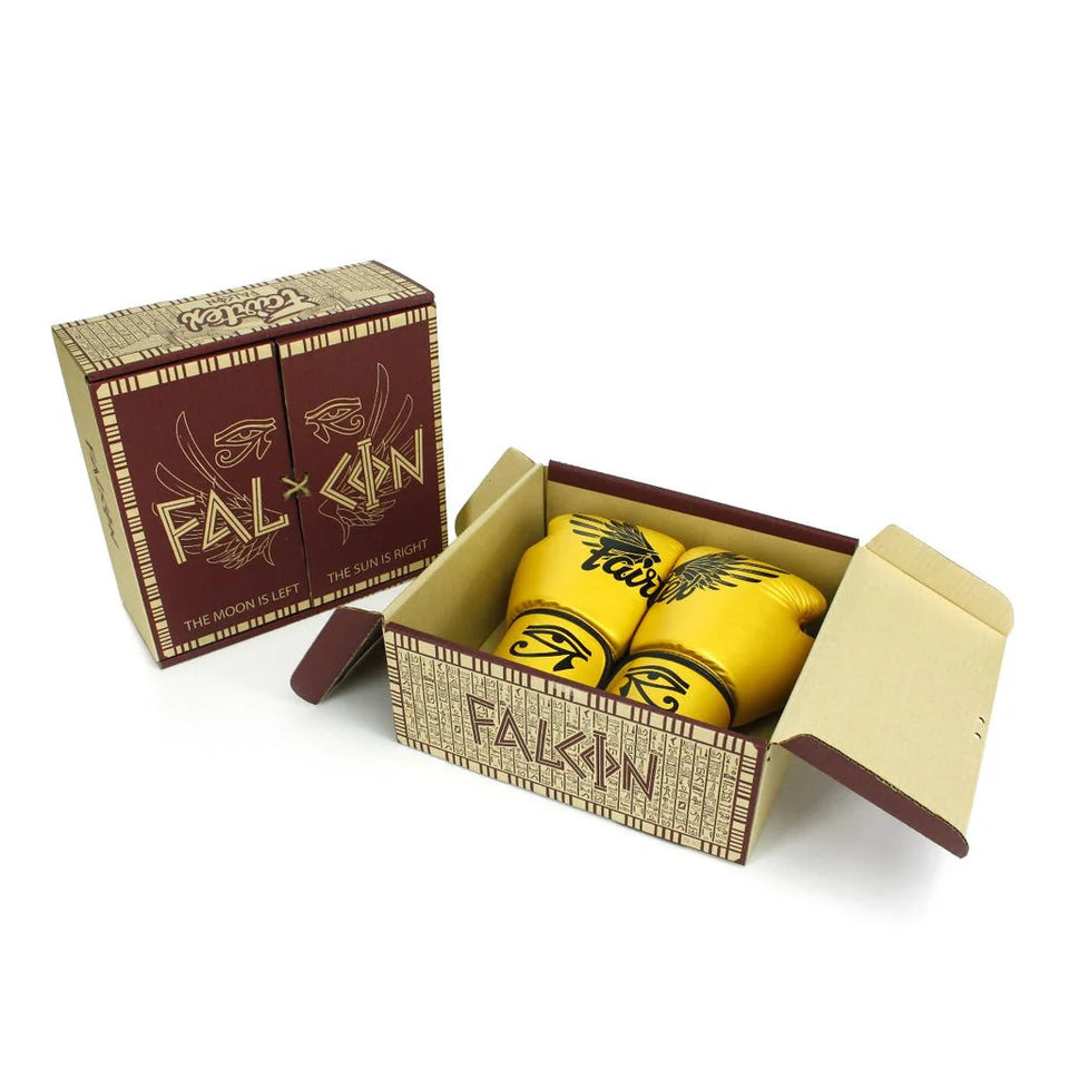 Yellow boxing gloves with 'Falcon' branding in an open box on a white background