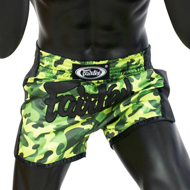 Camouflage athletic Muay Thai shorts with a brand logo on a mannequin.
