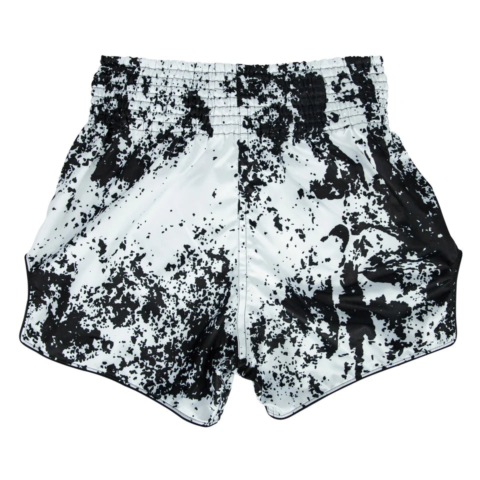 Black and white patterned Muay Thai shorts on a white background