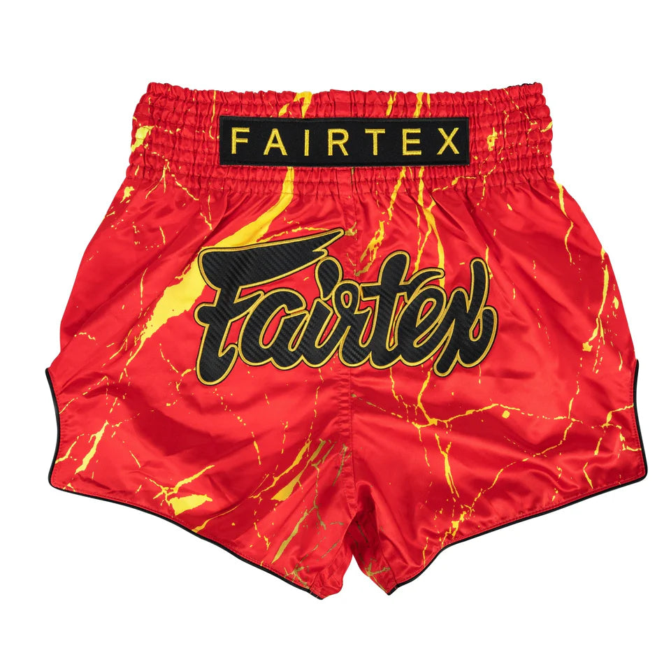 Red and yellow marbled Fairtex boxing shorts on a white background