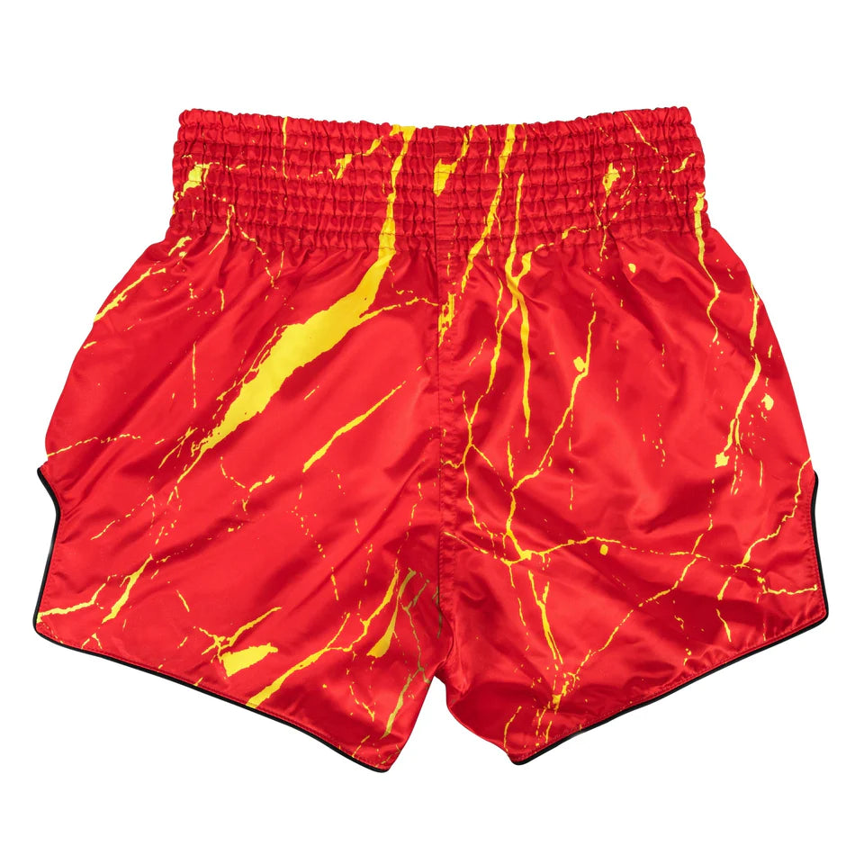 Red shorts with yellow abstract pattern on a white background