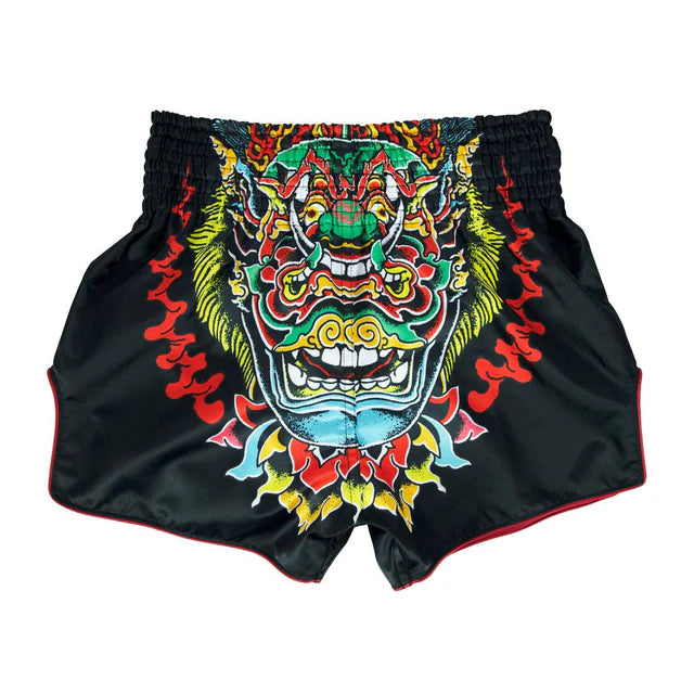 Black Muay Thai shorts with a colorful dragon design on a white background