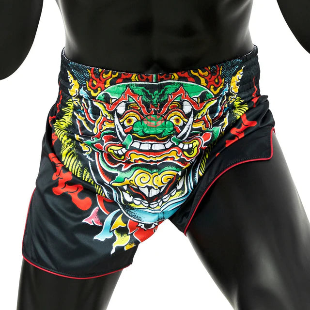 Black Muay Thai shorts with a colorful dragon design on a white background