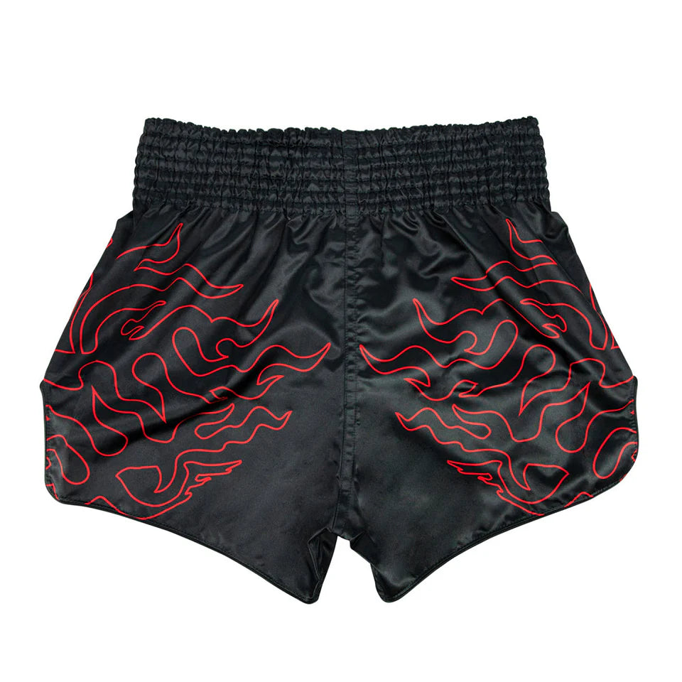 Black Muay Thai shorts with red flame patterns on a white background