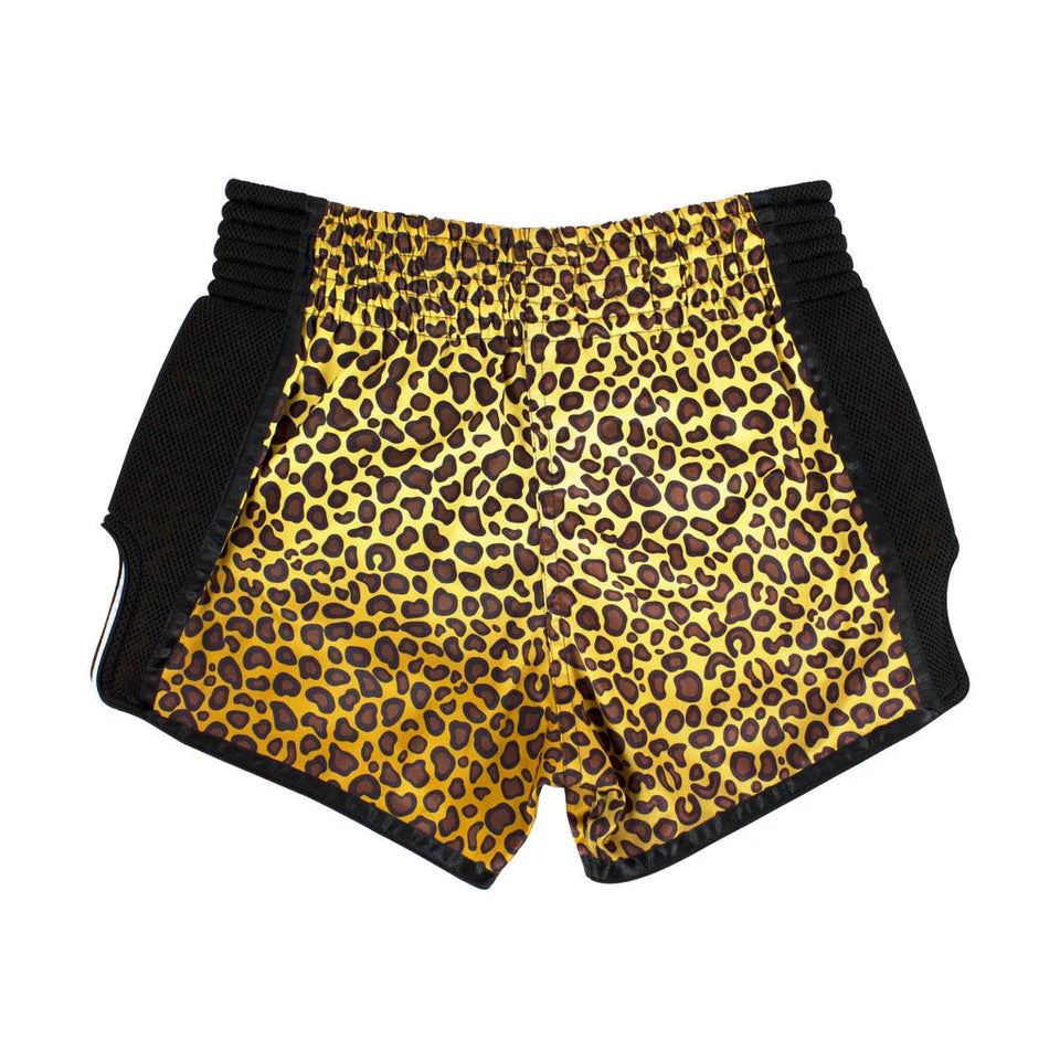Leopard print Muay Thai shorts with black trim on a white background