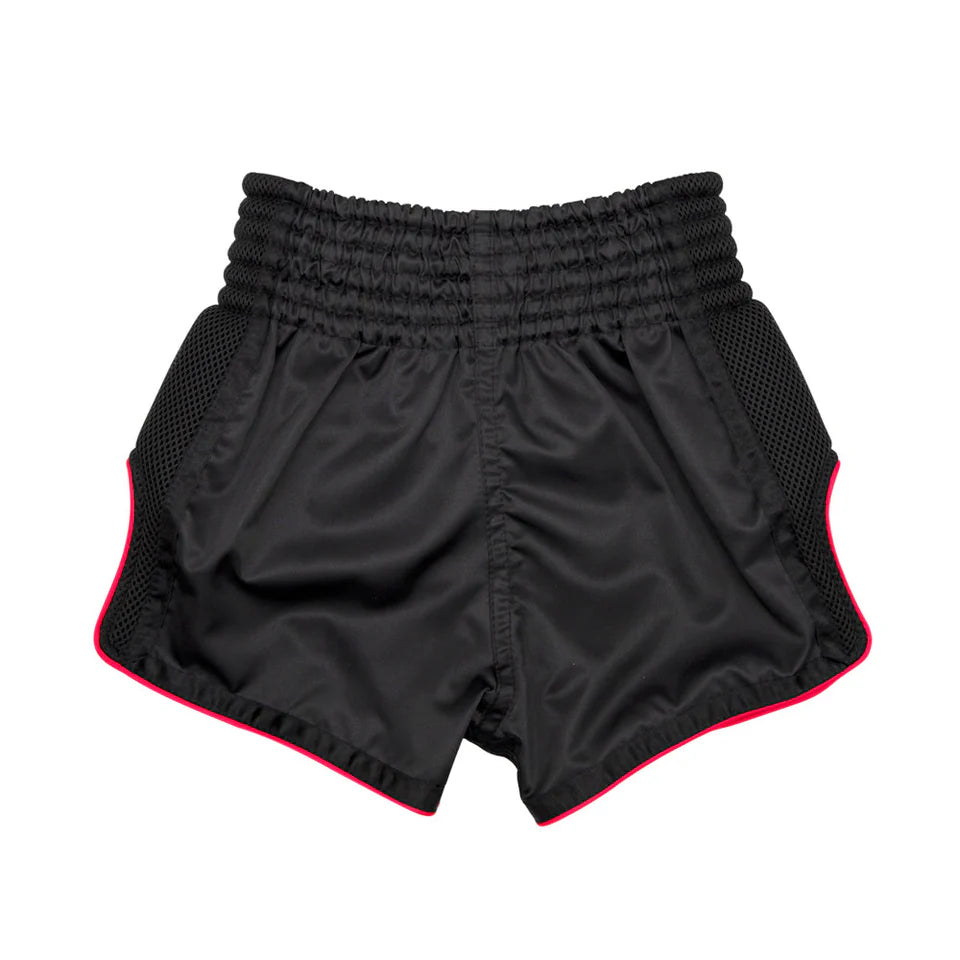 Black Muay Thai shorts with red trim on a white background