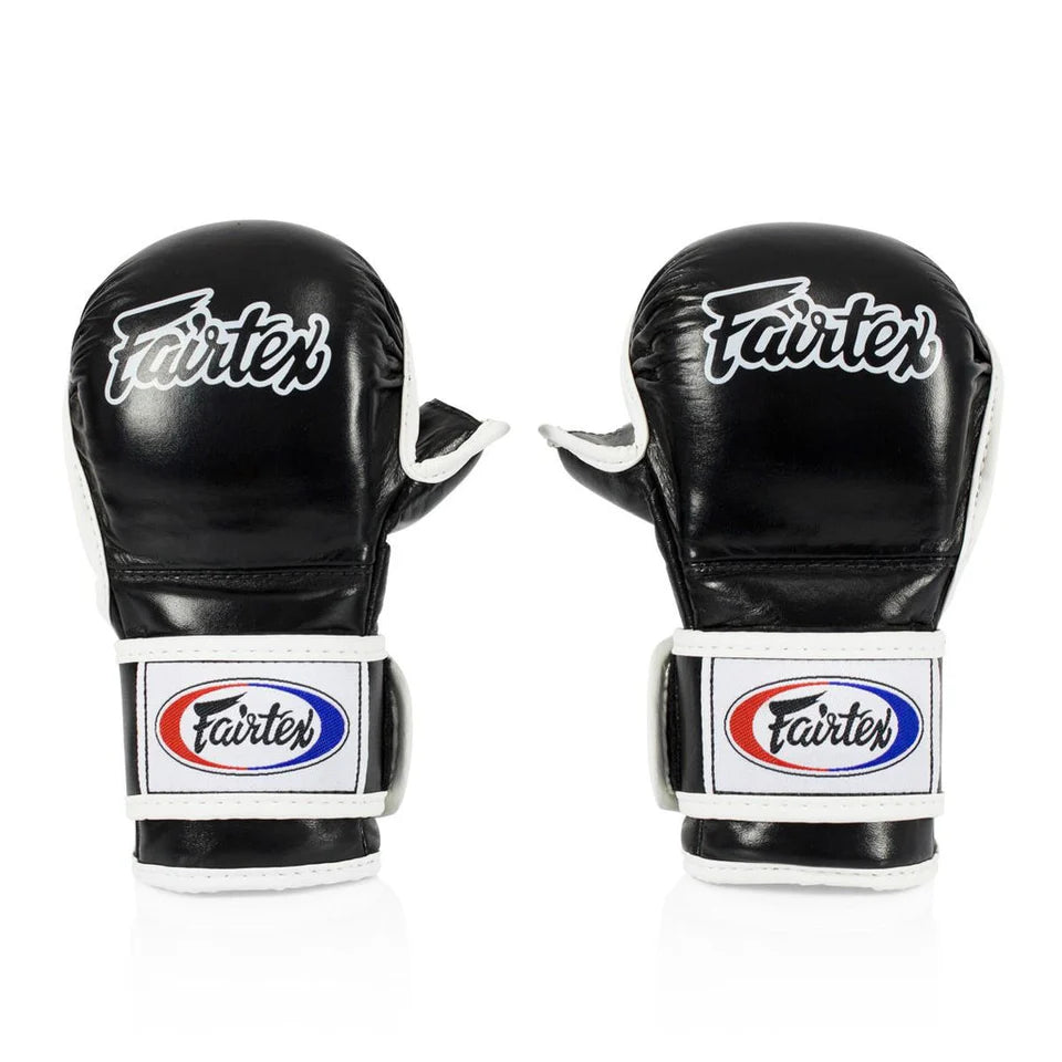 Pair of black Fairtex MMA sparring gloves on a white background