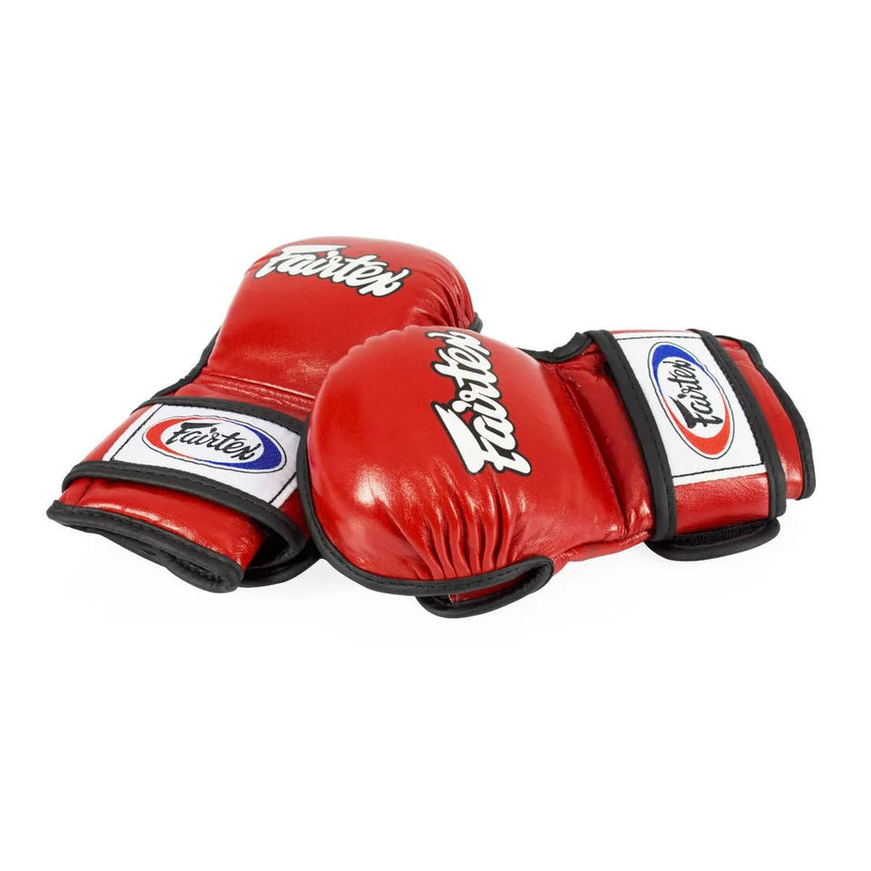 Red MMA sparring gloves with Fairtex logo on a white background