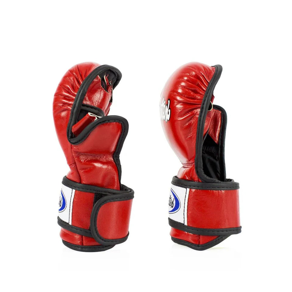 Red sparring gloves with black accents on a white background
