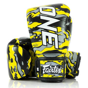 Yellow and black boxing gloves with 'Fairtex' branding on a white background