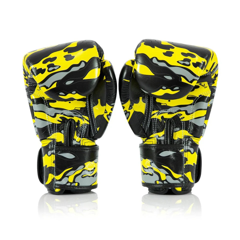 Pair of yellow and black camouflage boxing gloves on a white background