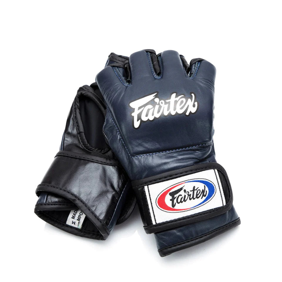 Pair of black Fairtex MMA gloves on a white background