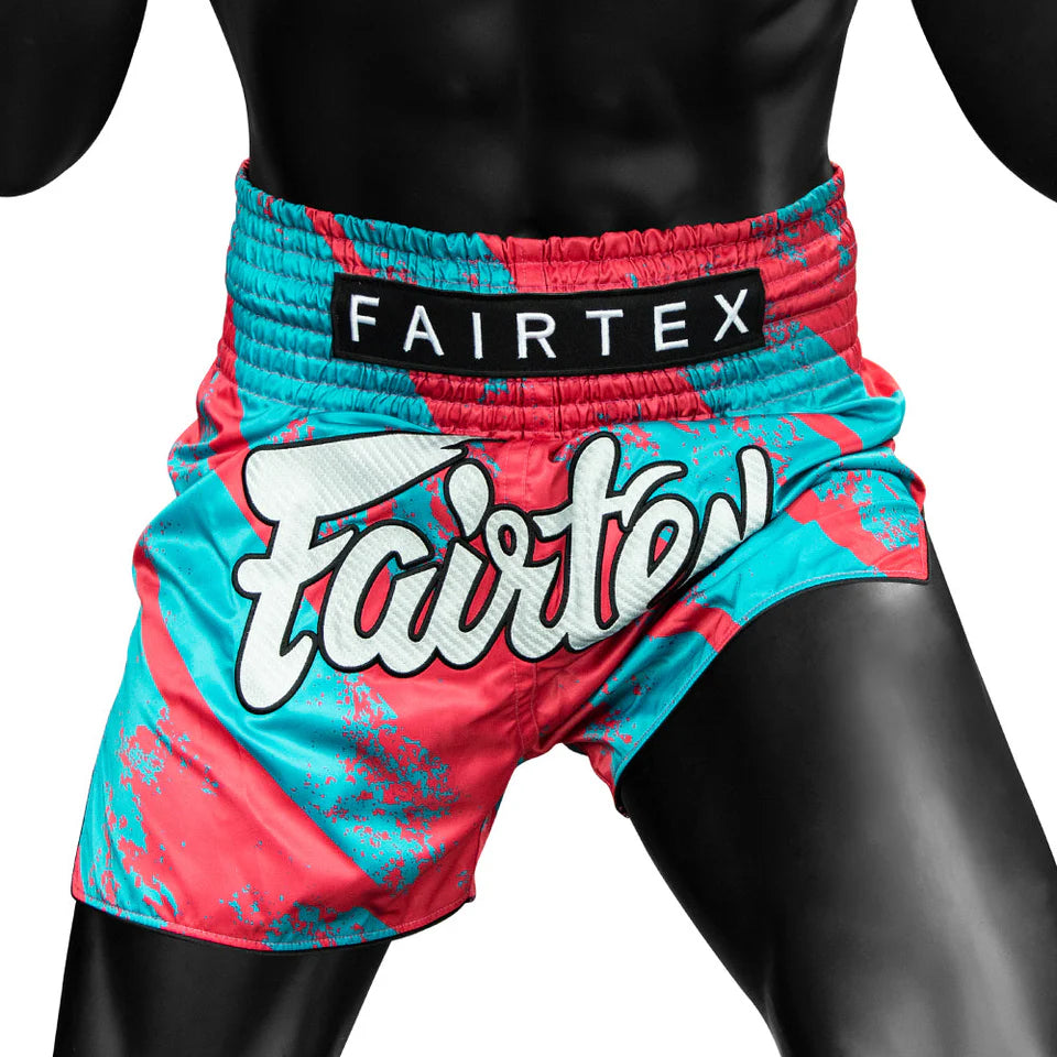 Colorful Fairtex boxing shorts on a black background