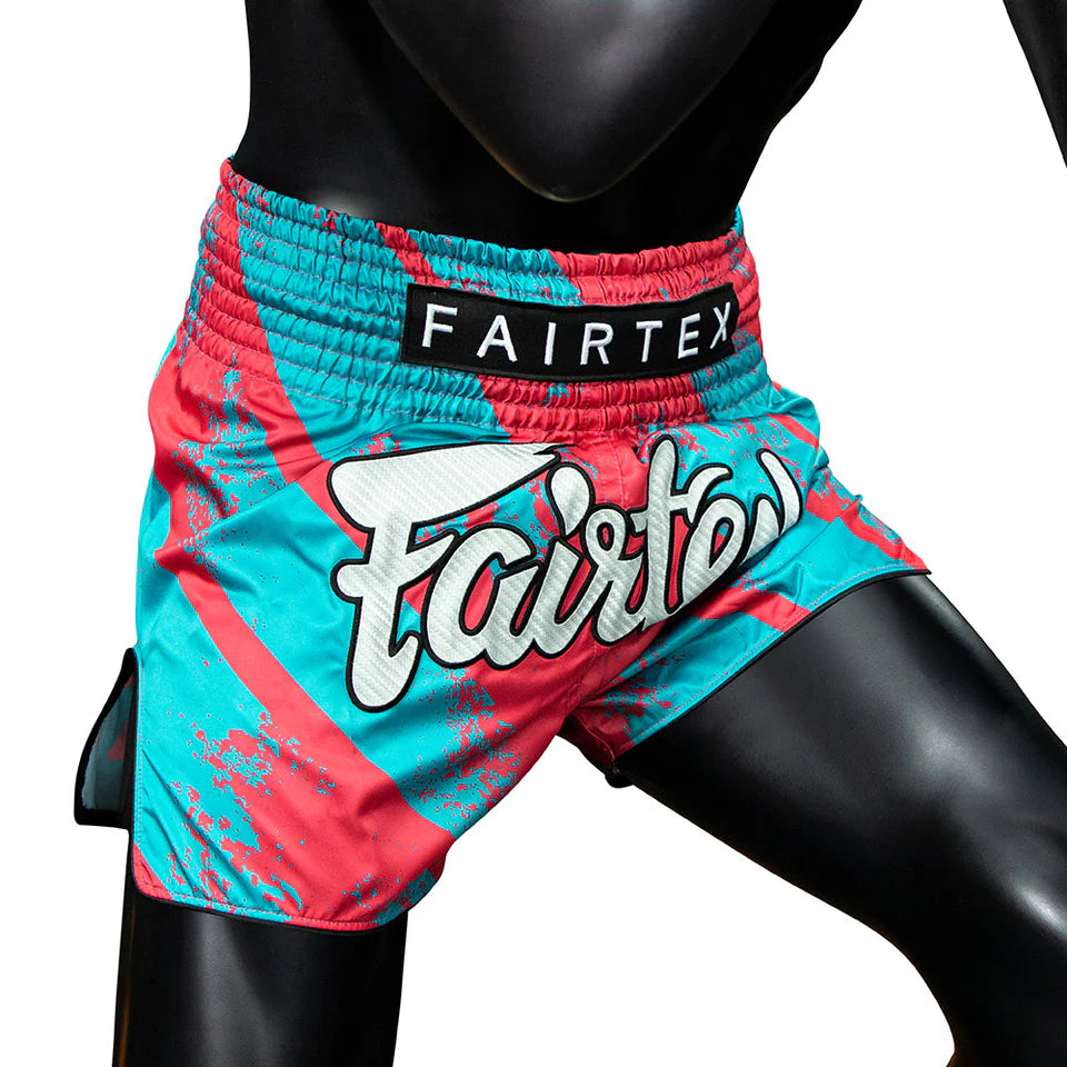 Colorful boxing shorts with Fairtex branding on a white background