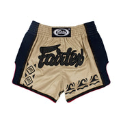 Beige Muay Thai shorts with black Fairtex logo on a white background