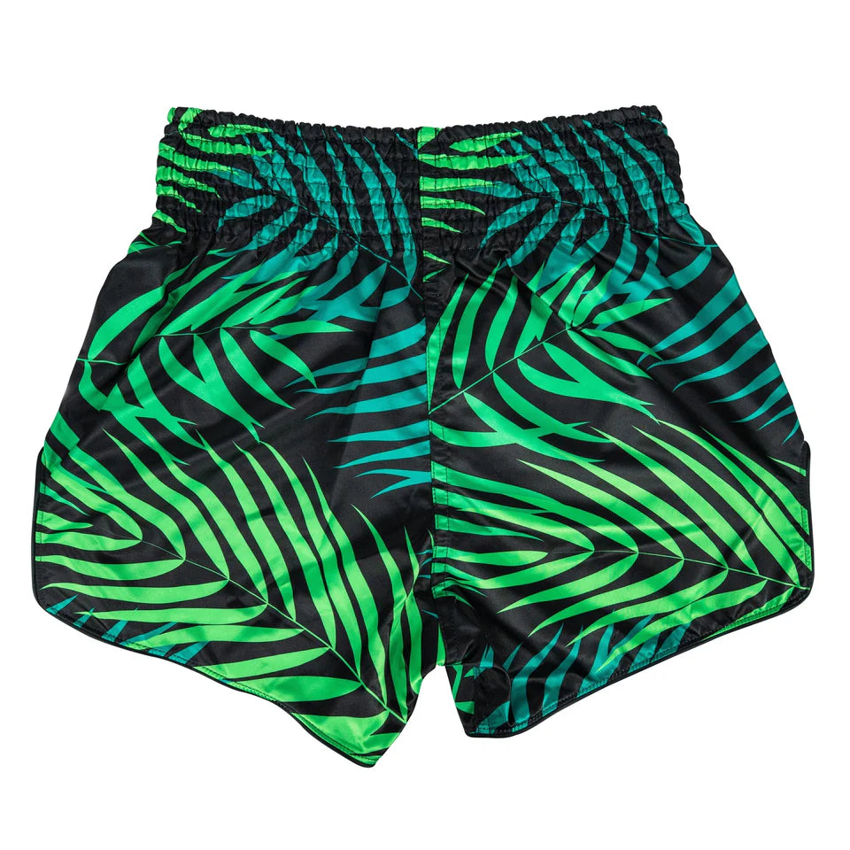 Green and black patterned Muay Thai shorts on a white background