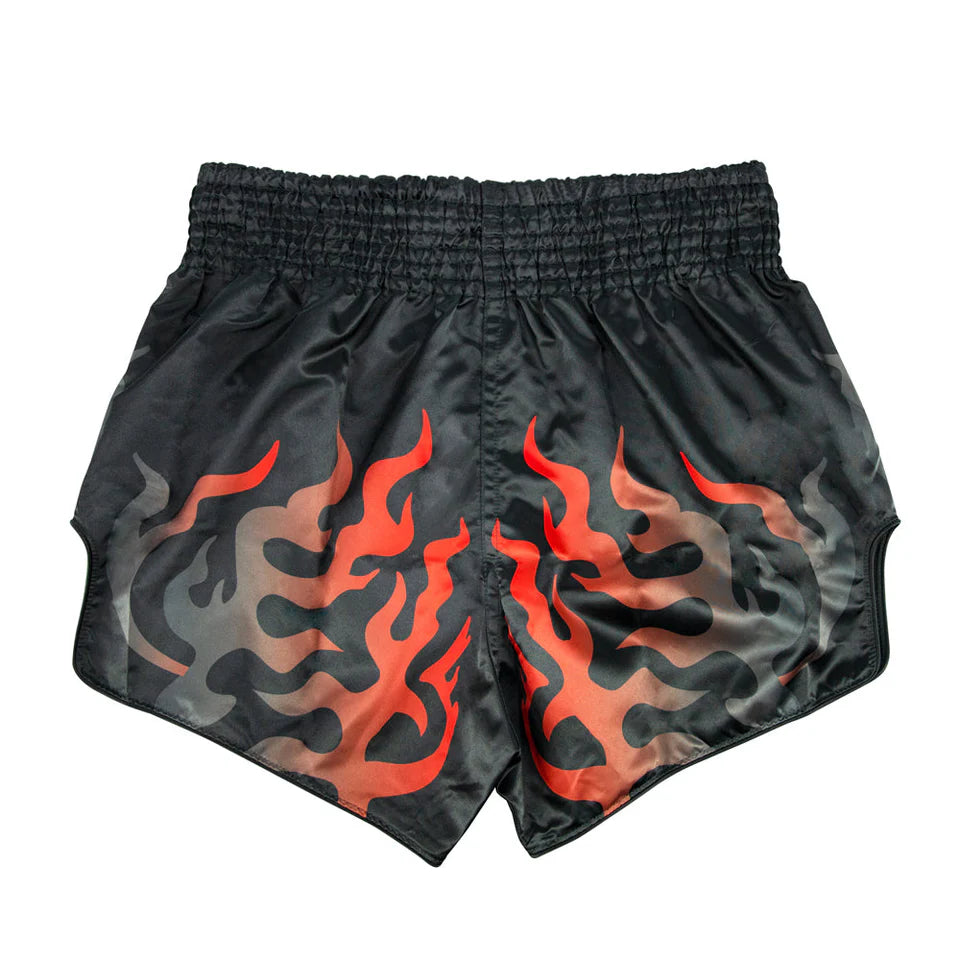 Black Muay Thai shorts with red flame pattern on a white background