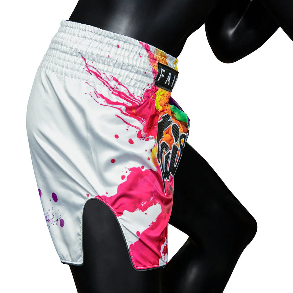 Colorful athletic Muay Thai shorts with a brand logo on a mannequin against a white background