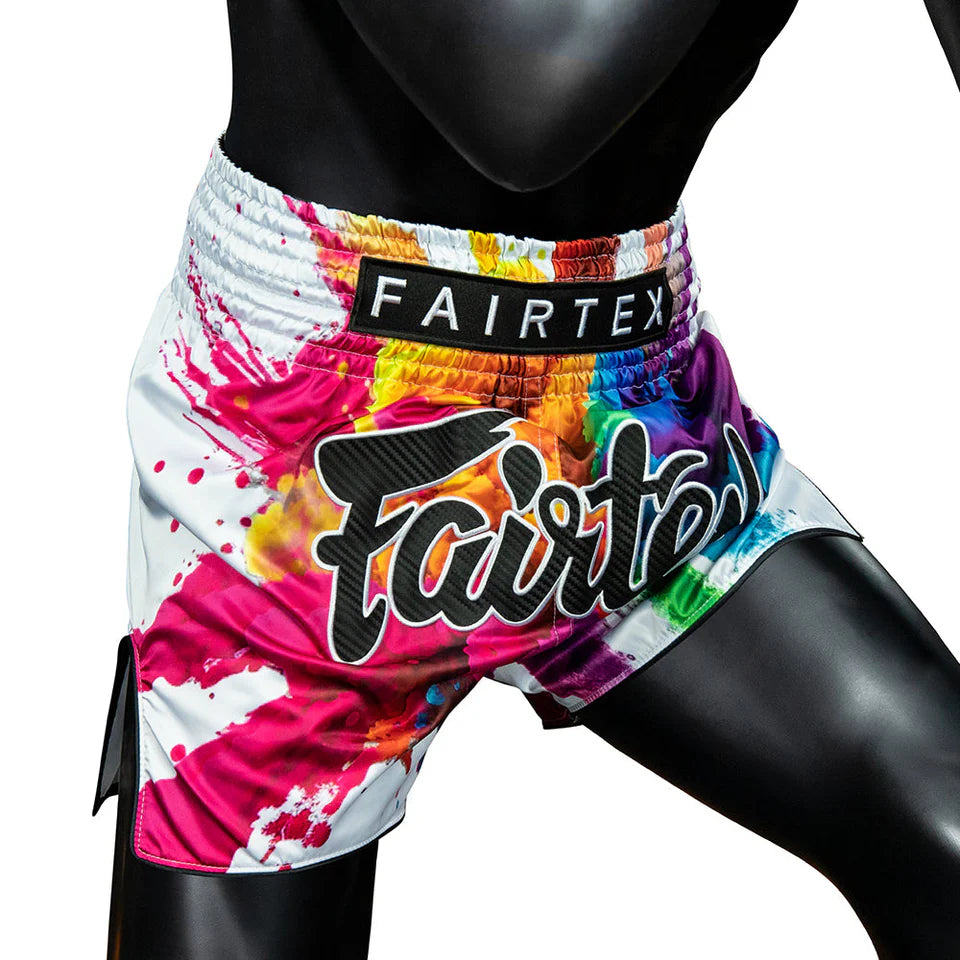 Colorful boxing shorts with 'Fairtex' branding on a white background