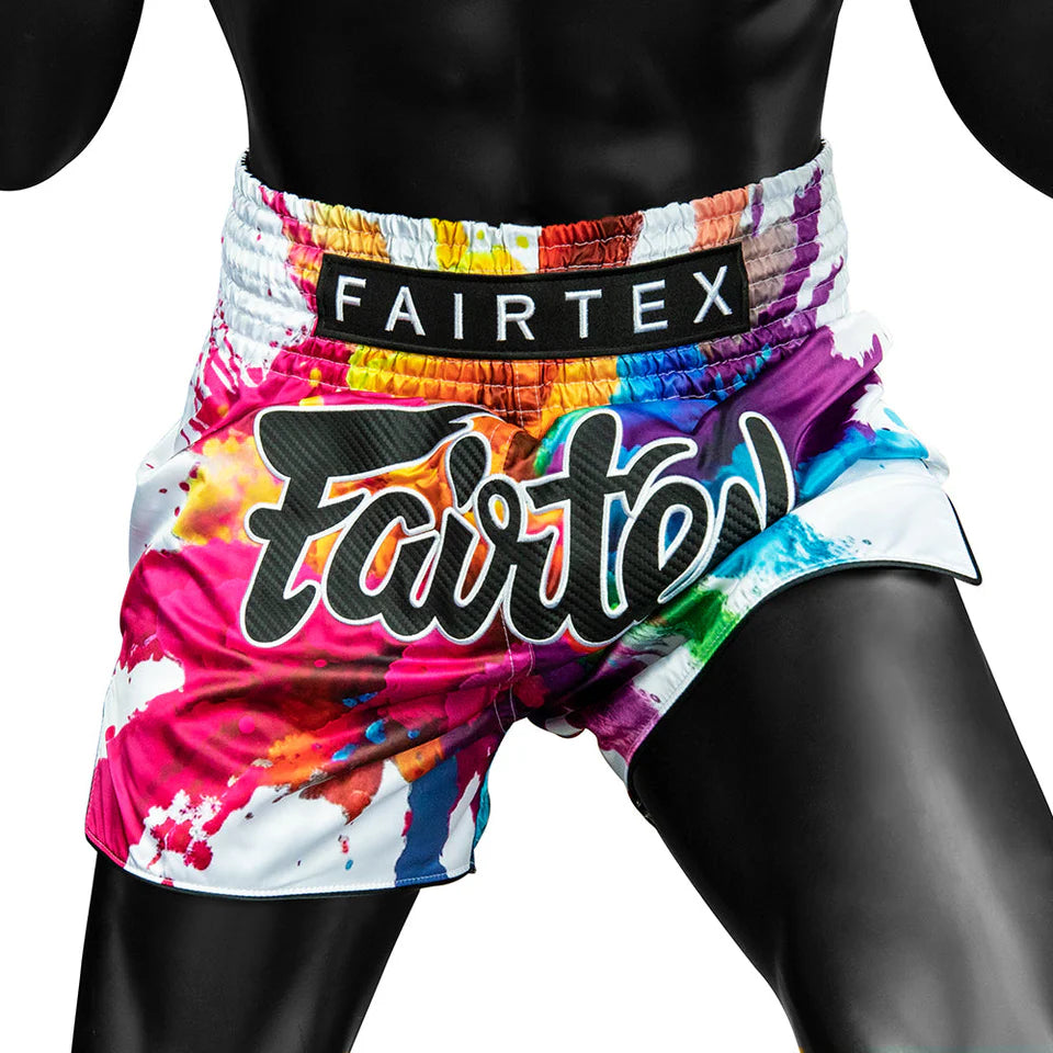 Colorful Fairtex boxing shorts with a rainbow design on a white background