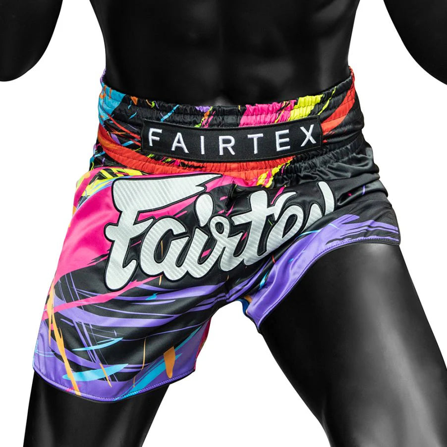 Colorful Fairtex Muay Thai shorts on a black background