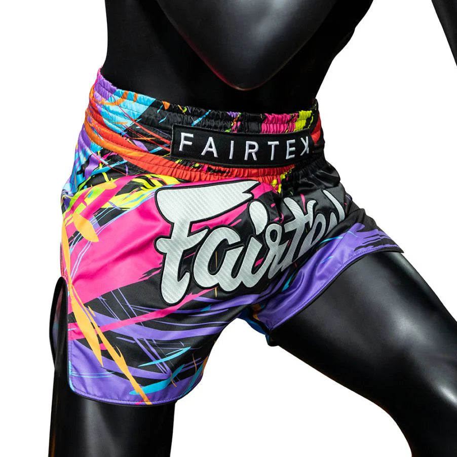 Colorful boxing shorts with 'Fairtex' branding on a white background