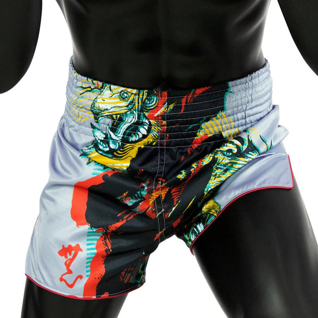 Colorful Muay Thai shorts with a tiger design on a black mannequin.