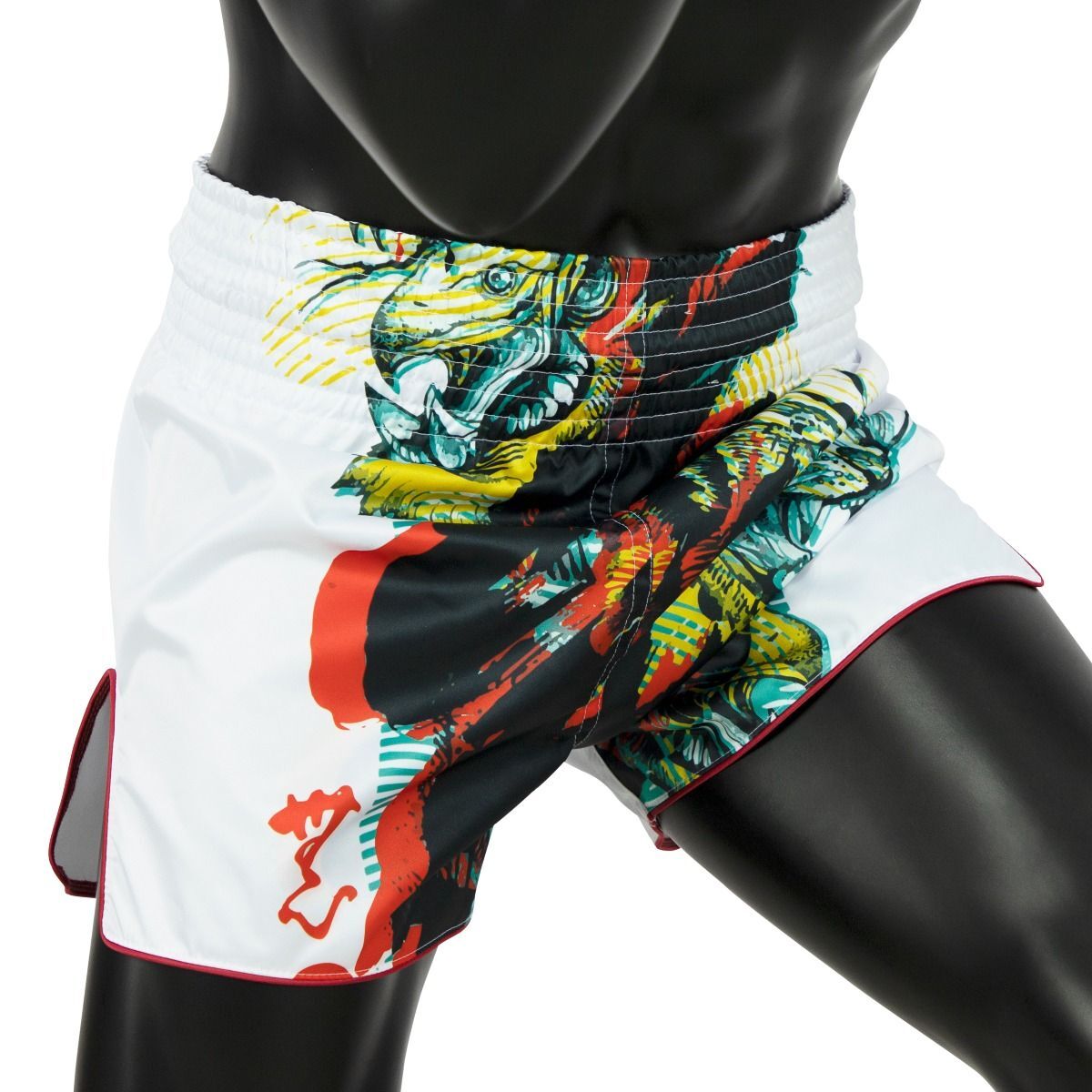 Colorful athletic Muay Thai shorts with a tiger design on a mannequin against a white background