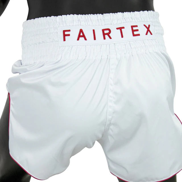 White boxing shorts with red Fairtex branding on a white background