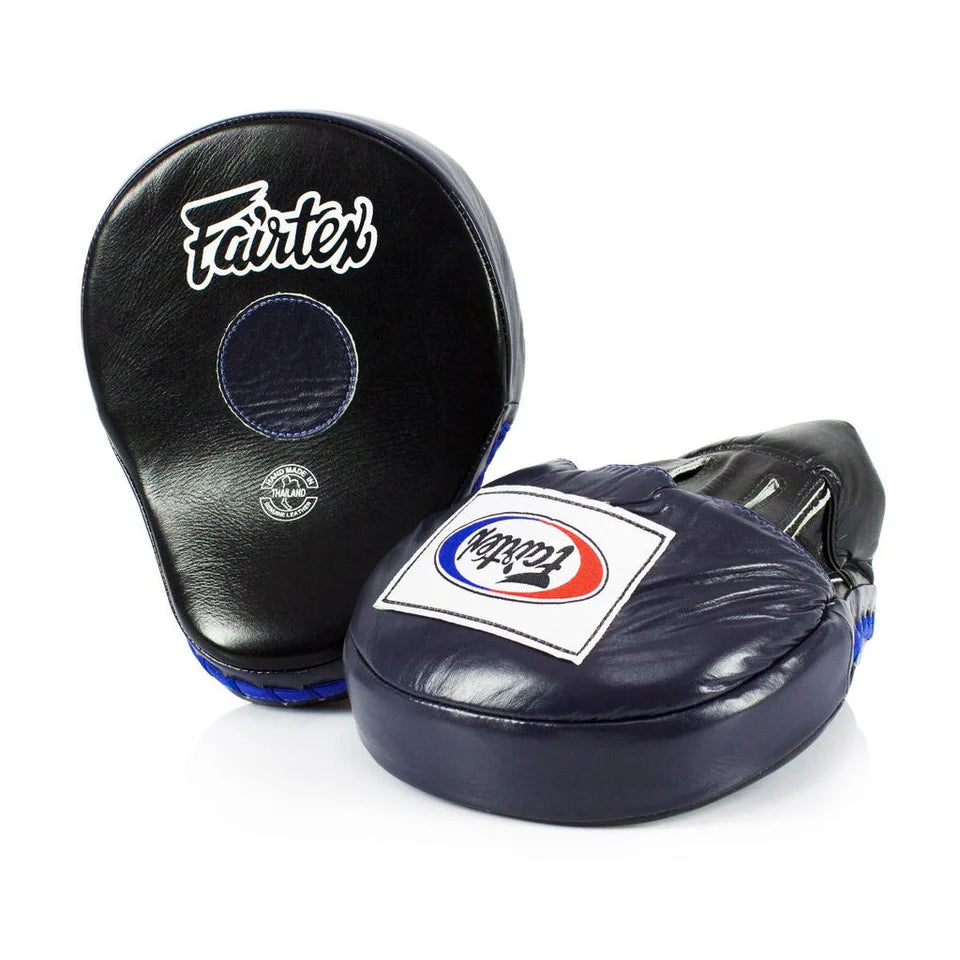Pair of black and blue boxing focus mitts with 'Fairtex' branding on a white background.