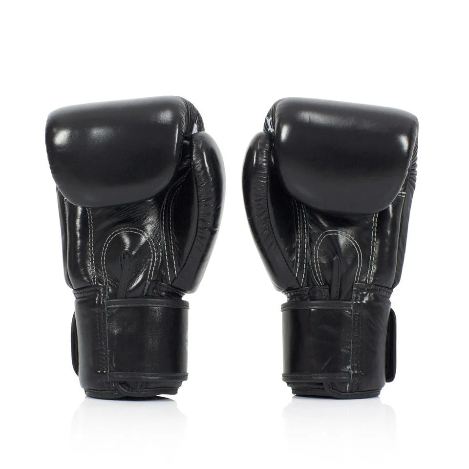 Pair of black boxing gloves on a white background