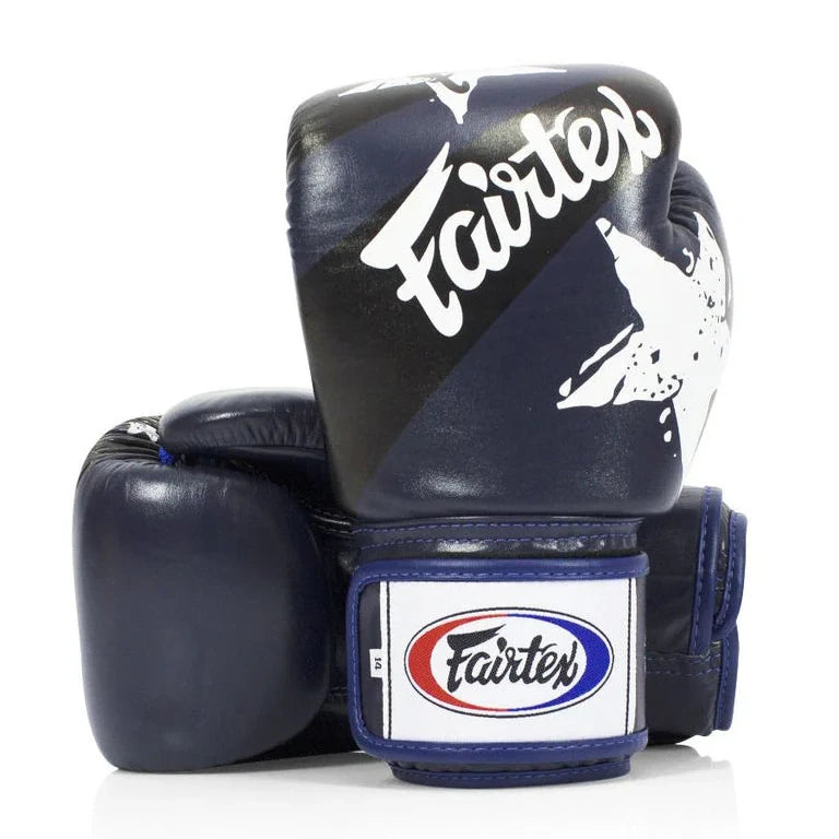 Pair of navy blue boxing gloves with Fairtex branding on a white background