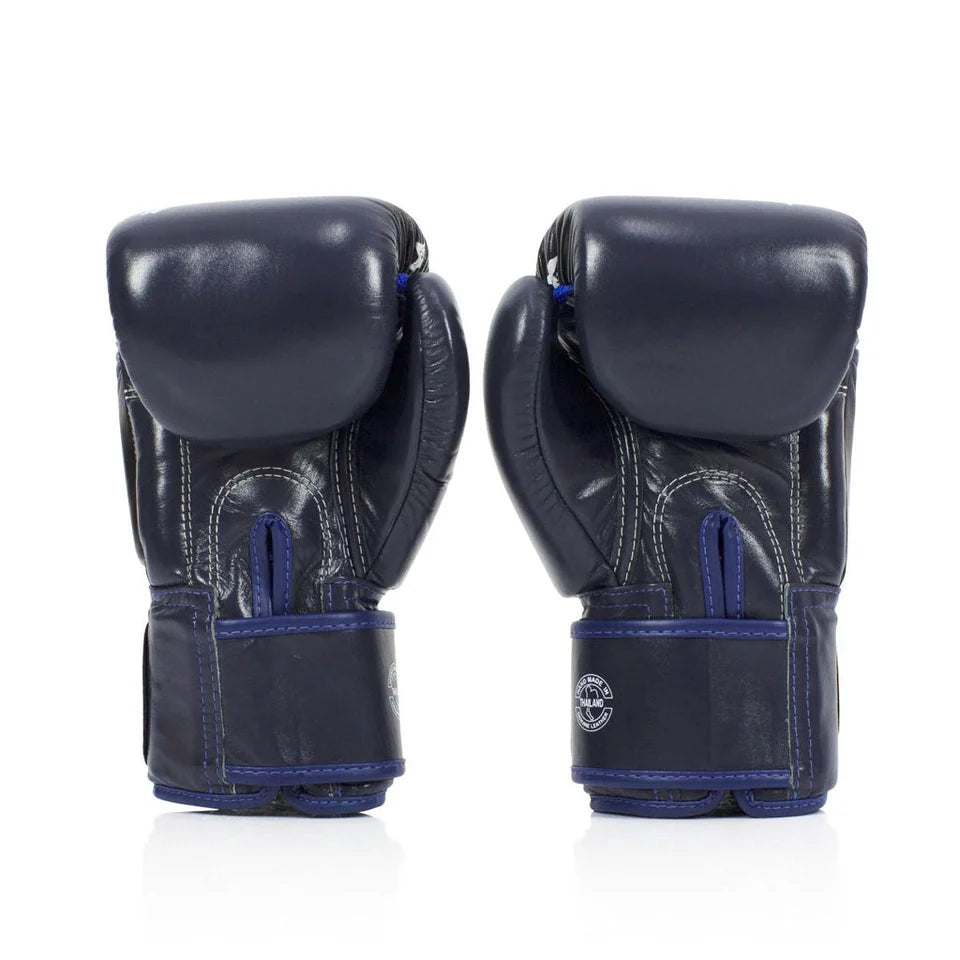 Pair of navy boxing gloves with blue accents on a white background