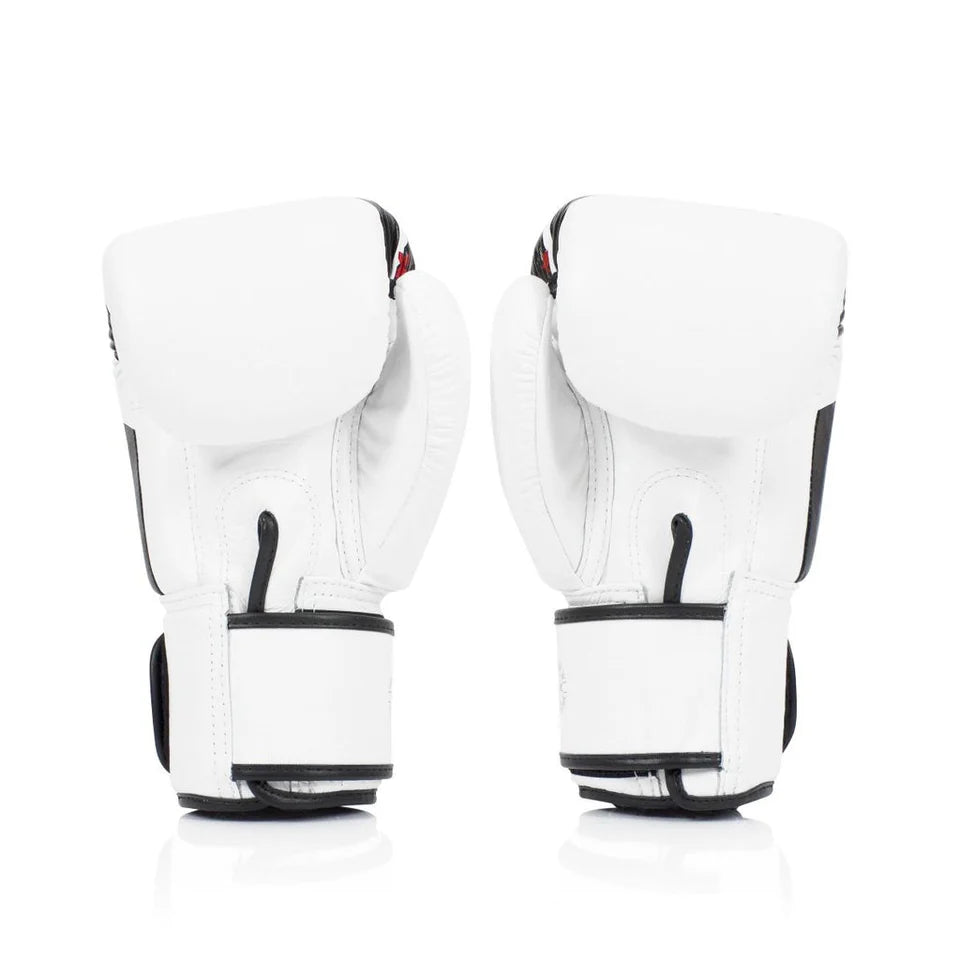 Pair of white boxing gloves with black accents on a white background